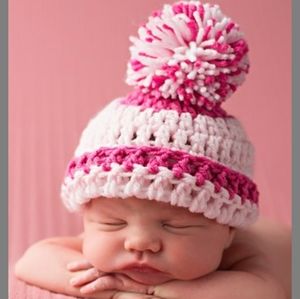Newborn hat, socks & pacifier holder